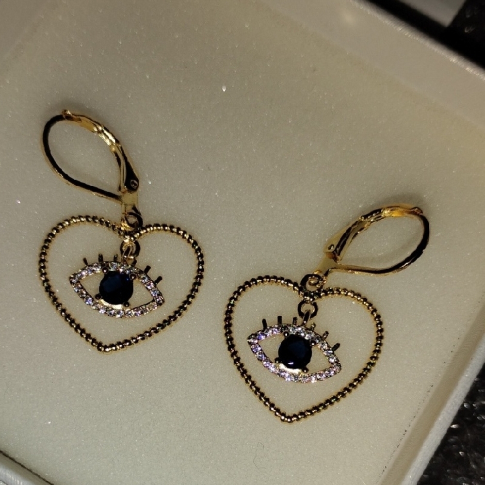 Gold Tone Heart Eye Earrings